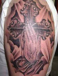 Why people prefer to pray for the praying hands tattoo with rosary. 18 Amazing Cross Hand Tattoos