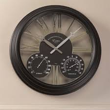It includes white arabic numbers. Outside In Exeter Wall Clock Thermometer 15 Inch Black 5061001