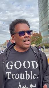 Ex-Fire Commissioner Garnell Whitfield Jr. speaks at the No Kings rally in  downtown Buffalo.