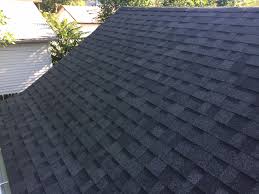 Close up view on asphalt roofing shingles background. New House Roof Oakridge Estate Gray Shingles And Sbs Rolled Roofing Installed In Denver Co Bob Behrends Roofing Gutters