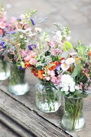 Real Weddings Jeannine And Jared S Florida Park Wedding Spring Wedding Centerpieces Wild Flower Arrangements Flower Arrangements