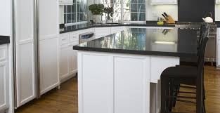 Modern kitchen with stainless steel cabinets and countertop. Quartz Countertop Overhang The Guidelines Pro Stone Countertops