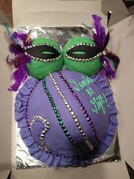 Traditionally, a small plastic baby is hidden in the king cake. Mardi Gras Theme Baby Shower 2012 Baby Shower Themes Baby Shower Mardi Gras