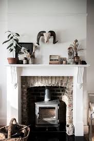 Andirons add a decorative embellishment to any fireplace. 20 Ideas To Decorate Around A Wood Burning Stove