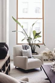 Photo 9 Of 9 In A Former Artist Studio Now Serves As A Serene Soho Oversized Chair Living Room Condo Living Room Soho Loft