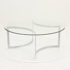 A minimalist coffee table with ascetic shape and conspicuous wood grain to create harmony in any living room. Minimalist Brushed Metal Glass Coffee Table By Paul Legeard 1970s 106502