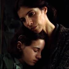 Mercedes hums the lullaby for Ofelia © Warner Bros. Entertainment Inc.