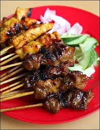 Satay Marinated Meat Chicken Beef Mutton Or Pork On A Stick Bbq D Served With Sliced Onions And Cucumber And You Dip Asian Recipes Food Pork On A Stick
