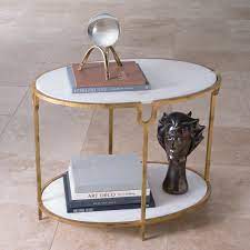 It's crafted with an iron base, and has a genuine marble surface. Iron And Stone Side Table