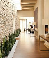 As the place where friends and family gather the most in a home, it's important for a living room to not only be inviting but well decorated. Receive The Natural Home Natural Stone Wall In The Living Room Interior Design Ideas Avso Org