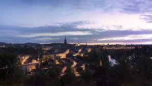 sunset over bern switzerland building illustration landscape photos aerial view