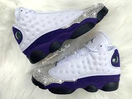 Air Jordan 13 Purple Black White Swarovski Women S Nike Air Jordan 13 Retro White Purple Sneakers Blinged With Authentic Clear Swarovski Crystals Custom Bling Nike Shoes In 2020 Bling Nike Shoes Air Jordans Retro Nike Air Jordan Shoes