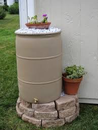 Having the rain barrel elevated will make it easier to fill your watering can or attach a hose. 15 Easy Diy Rain Barrel Stand Ideas Everyday Old House