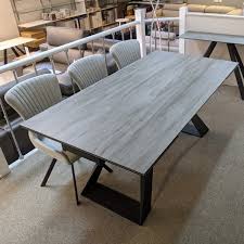 Extending dining tables come in a variety of shapes and sizes to fit your dining room needs. Kesterport Spartan Grey Wood Ceramic Extending Dining Table 6 10 Seater Extending Dining Tables