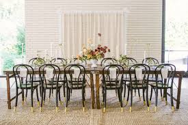 Bohemian Chic Wedding Dining Table Rustic Farm Tables With Black And Gold Bistro Chairs Over Neutral Seag Dining Table Rustic Rustic Farm Table Eclectic Rugs