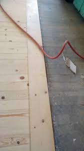 The laminate has to come up to replace the warping floor. Inexpensive Wood Floor That Looks Like A Million Dollars Do It Yourself
