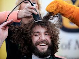 Columbia residents shave heads to aid fight against childhood cancer