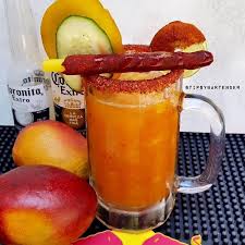Mango Michelada Fresh Mango Puree Fresh Lime Juice 1 Chilled Mexican Beer 1 Lime Coarse Salt Chamoy Sauce Hot Sauce Fresh Mango Cucumber Slices Tam Pinterest