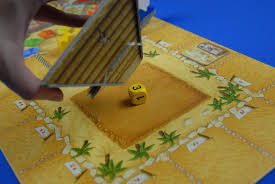 You have 5 colored dice to control which camels moves by how many steps. Review Camel Up