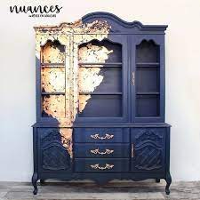 All mouldings were once painted in a high gloss paint because the higher the gloss the more durable the paint. From Outdated To Stunning Matte Black Paint And Cascading Gold Leaf Transformed This Cabinet Note That The Furniture Makeover Copper Furniture Redo Furniture