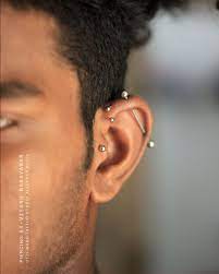 Tragus Forward Helix And Industrial Piercing By Otzi Marc Tattoo And Piercing Studio Alleppey Piercing Studio Piercing Industrial Piercing