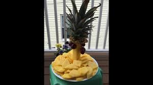 As they mature, the weight of the fruit pulls the branches down, making the tree look like a cascading fountain of fruit. How To Cut A Pineapple How To Make A Palm Tree From A Pineapple Youtube