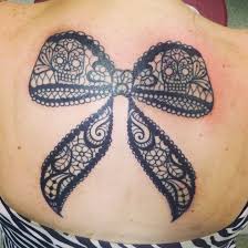 The resolution of image is 259x558 and classified to flower tattoo, skull tattoo, tear tattoo. Ribbon Bow Brushes Tattoo Designs