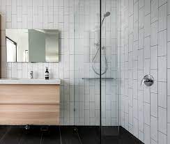 Small bathroom paint color ideas with white subway tile dark grout. Vertical Subway Tile With Dark Grout White Subway Tile Shower Custom Bathroom Cabinets Bathroom Mirror