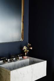 The textured navy of this bathroom wall's gives such a gloomy nuance. 15 Blue Bathroom Ideas That Will Leave You Mesmerized Hunker
