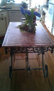 Here An Antique French Pastry Table Is Used For A Center Island Heavy Iron Scrolled Base An Rustic Dining Table French Country Decorating French Country Style