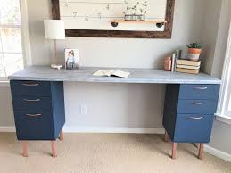 Then add a wide plank, also painted in the same white color between the two filing cabinets to create a makeshift desk. Ugly Home Office Makeover Part 5 The Diy File Cabinet Desk And How Chip Gaines Hair Inspired Me Beautiful Life Market