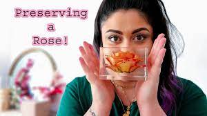Once the resin is mixed, gently pour the resin over the dried flowers and botanicals to fill the cavity area between the candle and glass vase side. How To Preserve A Full Rose In Resin Youtube