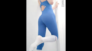 Slender trap teasing in tight one-piece yoga bodysuit and white socks