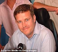 NRL commentator makes fun of a man in the crowd at Cowboys against Roosters  reading a shopping catalogue