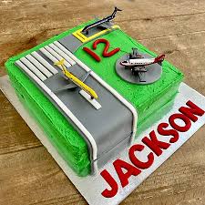 The two stacked cakes are covered in light blue fondant to resemble the sky, while simple geometric hills and cloud shapes are added with the birthday boy's age reflected in the film's title plaque. Diy Airport Cake Kit Unique Plane Birthday Cake Idea