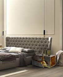 Most commercially made nightstands are between 24 and 28 inches tall, corresponding to the average mattress height of 25 inches. 26 Modern Nightstands For A Luxury Bedroom