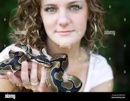 Person holding a snake hi-res stock photography and images