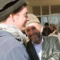 April Vasquez watches as her husband, U.S. Navy Fire