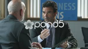 The commercial banking industry is huge and anyone looking to become a business banker will have a variety of sectors to choose from as the starting point for a career. Business Banker Using Ipad Tablet In Mee Stock Video Pond5