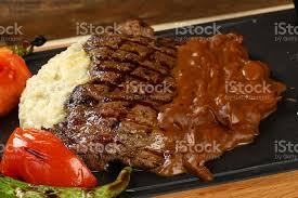 Maybe you would like to learn more about one of these? Grilled Beef Steak With Mushroom Sauce Stock Photo Download Image Now Istock