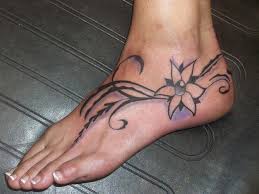 Having a tattoo on the foot successfully and beautifully inked on your feet is not just a responsibility of the tattoo artist. Pretty Filigri Flower Tattoo For Girls On Foot Tattooimages Biz