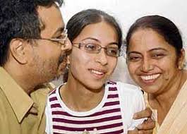 Bableen Kaur Bedi, who topped the Class XII ISCE board exam, with her parents in Chandigarh on Tuesday. Tribune photo by Parvesh Chauhan - ct1