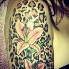 Cheetah print tattoo, also known as leopard print tattoo, is a great way to express your love for wildlife and leopard or cheetah in particular. Lily And Cheetah Print Cheetah Print Tattoos Leopard Print Tattoos Animal Print Tattoo