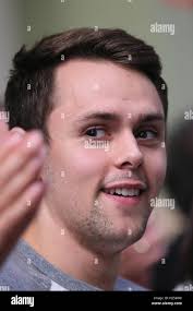 Oberstdorf, Germany. 24th Sep, 2016. Liam Cross from Great Britian, husband  of the figure skater Aljona Savchenko, sits in the stands at the 48th  Nebelhorn Trophy in Oberstdorf, Germany, 24 September 2016.