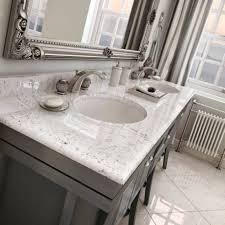 With the cute dimension, it certainly fits for small bathroom size. Carrara Marble Vanity Tops With Grey Cabinets Bathroom Marble Vanity Tops Gallery Marble Bathroom Bathroom Vanity Tops Marble Vanity Tops