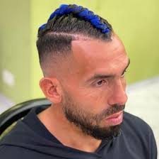 Raphael dias belloli, known as raphinha, is a brazilian professional footballer who plays as a winger for premier league club leeds united. Carlos Tevez Shows Off Daring New Haircut With Blue Braided Mohawk In Dramatic New Look From Old Long Locks Football Reporting