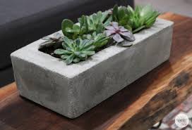 Tape down the top flaps to the outside of the larger box and remove the flaps on the smaller one. Diy Easy Concrete Planter Diy Huntress