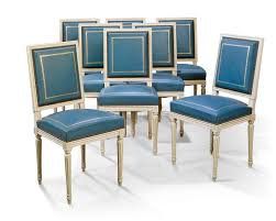 Chairs have a heraldic style cross maker's mark engraved on backs of chairs. A Set Of Eight White Painted And Blue Leather Side Chairs