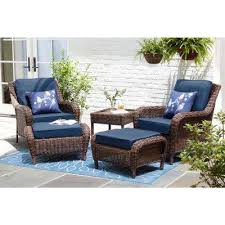 Hampton Bay Cambridge Brown Wicker Outdoor Patio Ottoman With Standard Midnight Navy Blue Cushions 65 17148b2 The Home Depot In 2020 Small Patio Furniture Outdoor Bistro Set Wicker Patio Furniture