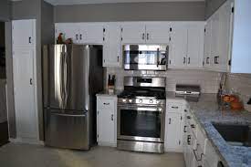 White Cabinets With Oil Rubbed Bronze Hardware And Stainless Steel Appliances Appliances White Cabinets Bronze Kitchen Bronze Kitchen Hardware